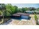 Aerial view of the home showcasing its large backyard and enclosed patio at 1229 Deneece Ter, Daytona Beach, FL 32117
