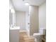 Bathroom with wood floors, vanity, and shower/tub combo at 1229 Deneece Ter, Daytona Beach, FL 32117