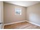 This bedroom features a wood-look floor and a light-filled window at 1229 Deneece Ter, Daytona Beach, FL 32117
