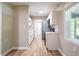 Modern kitchen features stainless steel appliances, white cabinets, and stylish backsplash at 1229 Deneece Ter, Daytona Beach, FL 32117