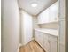 Pantry with ample storage space, featuring stylish white cabinets and countertops at 1229 Deneece Ter, Daytona Beach, FL 32117