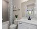 Well-lit bathroom with white vanity, marble countertop, and modern fixtures at 13551 Pearl Beach St, Winter Garden, FL 34787
