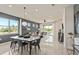 The dining area is bright and airy with lots of natural light, and it is the center of the home's open living space at 13551 Pearl Beach St, Winter Garden, FL 34787