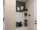 Welcoming entryway with custom storage and seating is conveniently situated for organization at 13551 Pearl Beach St, Winter Garden, FL 34787