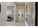 Bright hallway with tile floors provides seamless transition between rooms, offering an airy feel at 13551 Pearl Beach St, Winter Garden, FL 34787