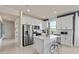 Contemporary kitchen showcases an island with seating, stainless appliances, and abundant cabinet space at 13551 Pearl Beach St, Winter Garden, FL 34787
