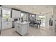 Spacious open-concept kitchen with a large island and plenty of seating is well-suited for entertaining at 13551 Pearl Beach St, Winter Garden, FL 34787