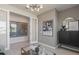 Relaxing living room with Disney theming, bright light, modern lighting, and neutral decor at 13551 Pearl Beach St, Winter Garden, FL 34787