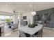Bright and airy living space featuring open floor plan to dining area, contemporary furnishings, and lots of natural light at 13551 Pearl Beach St, Winter Garden, FL 34787