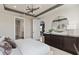 Main bedroom with open doorways, stylish lighting, and a sleek dresser at 13551 Pearl Beach St, Winter Garden, FL 34787