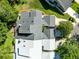 Aerial view showcases the roof structure and landscaping of a property at 140 Deer Lake Cir, Ormond Beach, FL 32174