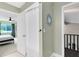 Hallway bathroom with framed mirror and partial view of bedroom at 140 Deer Lake Cir, Ormond Beach, FL 32174