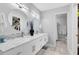 Bathroom with double sinks, granite countertops, decorative backsplash, and modern fixtures at 140 Deer Lake Cir, Ormond Beach, FL 32174