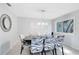 Elegant dining room with a stylish chandelier and seating for up to six guests at 140 Deer Lake Cir, Ormond Beach, FL 32174