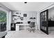 Dedicated home office with a large desk, natural light, and convenient outdoor access at 140 Deer Lake Cir, Ormond Beach, FL 32174