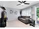 Comfortable living room with neutral tones, sheer curtains, and modern decor at 140 Deer Lake Cir, Ormond Beach, FL 32174