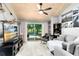 Inviting living room with wood-planked ceiling, large sliding doors, and comfortable furnishings at 140 Deer Lake Cir, Ormond Beach, FL 32174