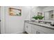 Bathroom featuring double sinks, granite countertops, and modern fixtures at 1495 Fountain View St, Ormond Beach, FL 32174