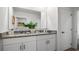 Bathroom featuring double sinks, granite countertops, and modern fixtures at 1495 Fountain View St, Ormond Beach, FL 32174