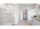 Bright bathroom with a large shower stall and double sink vanity with granite countertops at 1495 Fountain View St, Ormond Beach, FL 32174