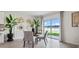 Bright dining area with modern accents and a view of the lake at 1495 Fountain View St, Ormond Beach, FL 32174