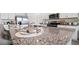 Kitchen island featuring stainless steel appliances and granite countertops at 1495 Fountain View St, Ormond Beach, FL 32174