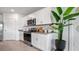 Bright kitchen with white cabinets, granite countertops, stainless steel appliances, and elegant decor at 1495 Fountain View St, Ormond Beach, FL 32174