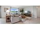 Comfortable living room featuring stylish decor, a large window with scenic views, and an inviting sofa at 1495 Fountain View St, Ormond Beach, FL 32174