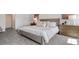 This main bedroom features soft carpet, neutral decor, and stylish wood furniture at 1495 Fountain View St, Ormond Beach, FL 32174