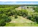 Lush, expansive green space, complemented by the natural beauty of the surrounding trees at 1508 Lake Mills Rd, Chuluota, FL 32766