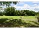 Green, expansive backyard perfect for outdoor activities and enjoying the serene natural surroundings at 1508 Lake Mills Rd, Chuluota, FL 32766