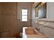 Bathroom with tiles, a framed mirror, and a pink sink at 1508 Lake Mills Rd, Chuluota, FL 32766