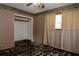 Empty bedroom with peeling floors, a ceiling fan, and an empty closet at 1508 Lake Mills Rd, Chuluota, FL 32766