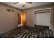 Bedroom featuring walls with wallpaper trim, ceiling fan, and damaged flooring at 1508 Lake Mills Rd, Chuluota, FL 32766