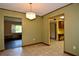 Dining room with chandelier, tile floor and views into the living room and kitchen at 1508 Lake Mills Rd, Chuluota, FL 32766