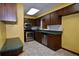 Efficient kitchen with stainless steel appliances, wood cabinets, and a green countertop at 1508 Lake Mills Rd, Chuluota, FL 32766