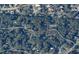 Aerial view of the parcel surrounded by trees, illustrating a tranquil setting and residential neighborhood at 160 Steeplechase Cir, Sanford, FL 32771