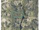 An aerial view of the property showcasing lot size and its location in a neighborhood surrounded by lush trees at 160 Steeplechase Cir, Sanford, FL 32771