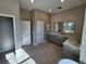 Bright bathroom with double sinks, a linen tower and recessed lighting at 160 Steeplechase Cir, Sanford, FL 32771