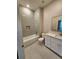 Well-lit bathroom featuring modern tile, a shower-tub combo, sleek vanity, and a white commode at 160 Steeplechase Cir, Sanford, FL 32771
