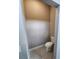 Small neutral-toned powder room with a toilet and tile floor at 160 Steeplechase Cir, Sanford, FL 32771