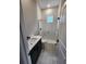 Bathroom boasting a sleek vanity, toilet, and glass-enclosed shower at 160 Steeplechase Cir, Sanford, FL 32771