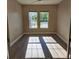 Well-lit bedroom offering wood floors and two windows for natural light at 160 Steeplechase Cir, Sanford, FL 32771