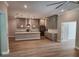Modern kitchen featuring grey cabinets, hardwood floors, and a center island at 160 Steeplechase Cir, Sanford, FL 32771