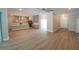 An open floorplan shows living room, kitchen with stainless appliances, and hardwood floors at 160 Steeplechase Cir, Sanford, FL 32771