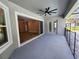 Inviting covered patio with outdoor ceiling fan, and access to both the pool area and the living room at 160 Steeplechase Cir, Sanford, FL 32771