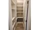 Well-lit pantry featuring custom shelving and storage, perfect for organization at 160 Steeplechase Cir, Sanford, FL 32771
