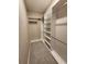 Walk-in closet featuring custom shelving and hanging rods to maximize storage space at 160 Steeplechase Cir, Sanford, FL 32771