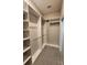 Spacious walk-in closet with custom shelving and ample storage solutions at 160 Steeplechase Cir, Sanford, FL 32771
