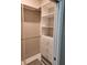 Organized walk-in closet with shelving, drawers and rods, designed for optimal storage and accessibility at 160 Steeplechase Cir, Sanford, FL 32771